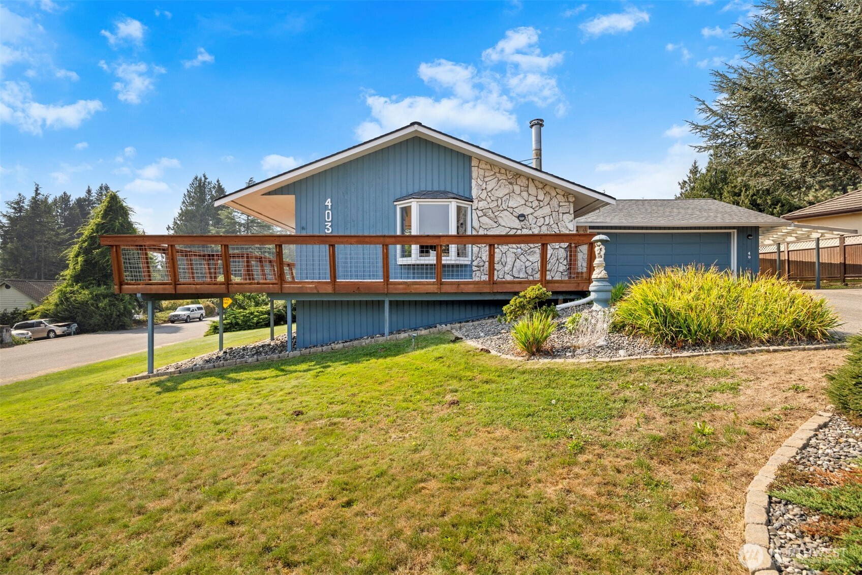 403 17th Street Lynden, WA 98264 - Photo 32 of 40 a view of a house with pool and chairs