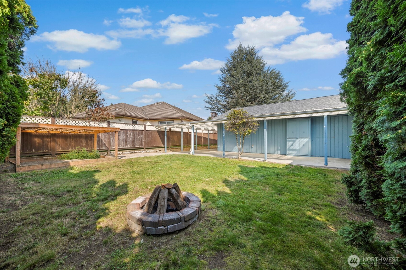 403 17th Street Lynden, WA 98264 - Photo 5 of 40 a view of a house with a backyard and pool