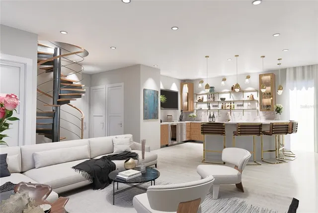 a living room with furniture and kitchen view