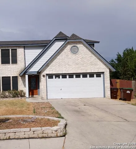 a view of house with yard