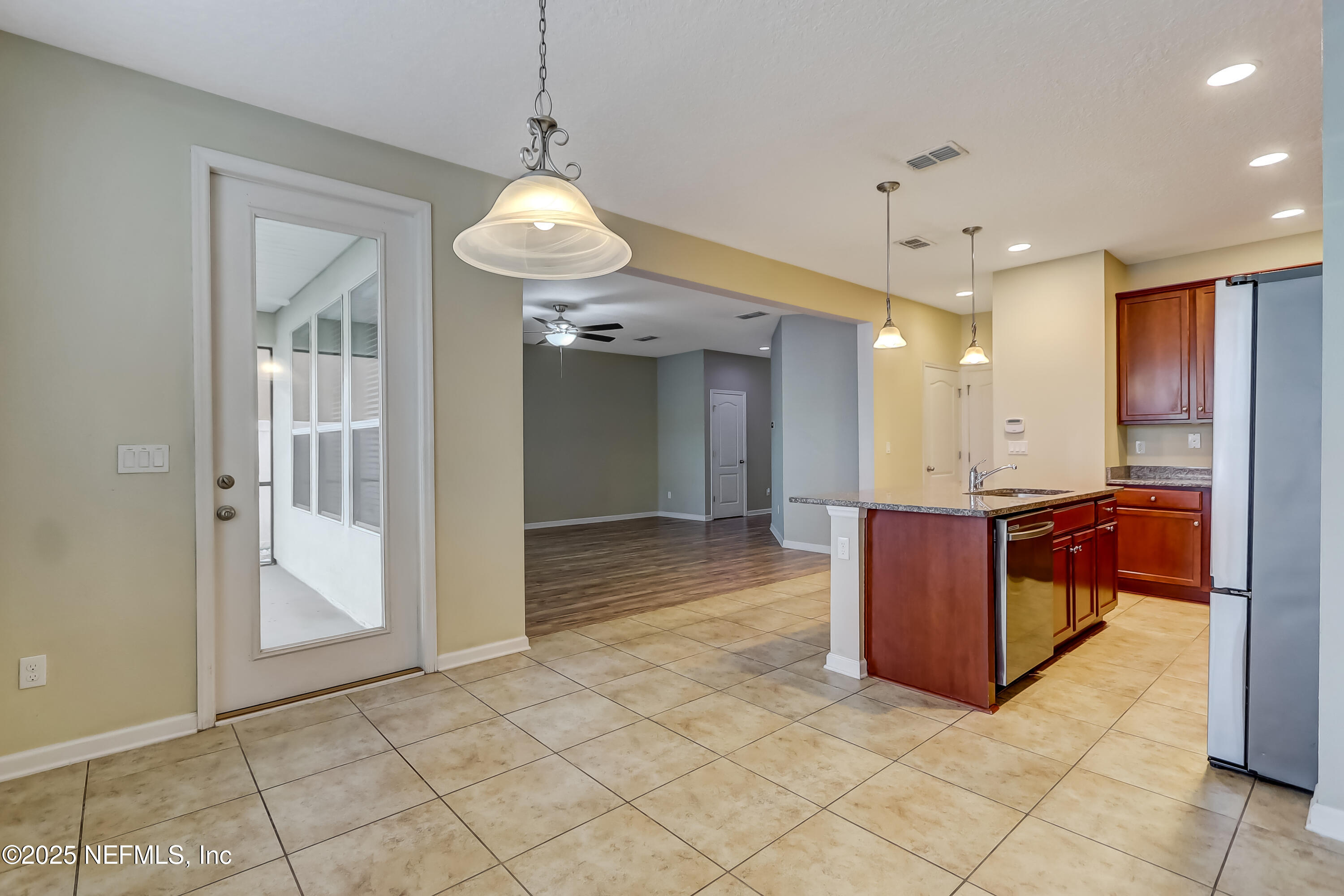 3838 Chasing Falls Road Orange Park, FL 32065 - Photo 14 of 36 a view of kitchen with refrigerator and window