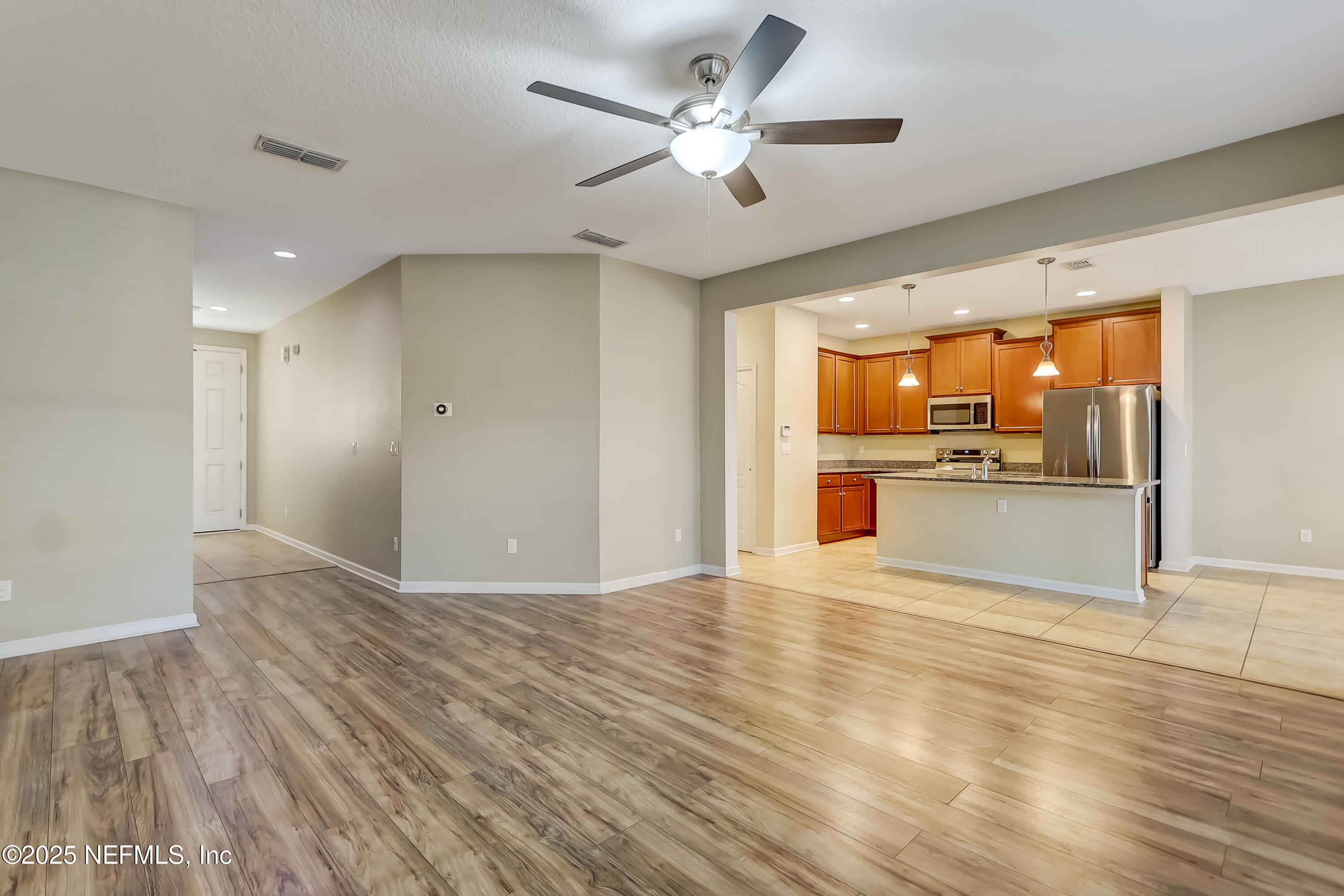 3838 Chasing Falls Road Orange Park, FL 32065 - Photo 17 of 36 a view of a kitchen with a sink and a refrigerator