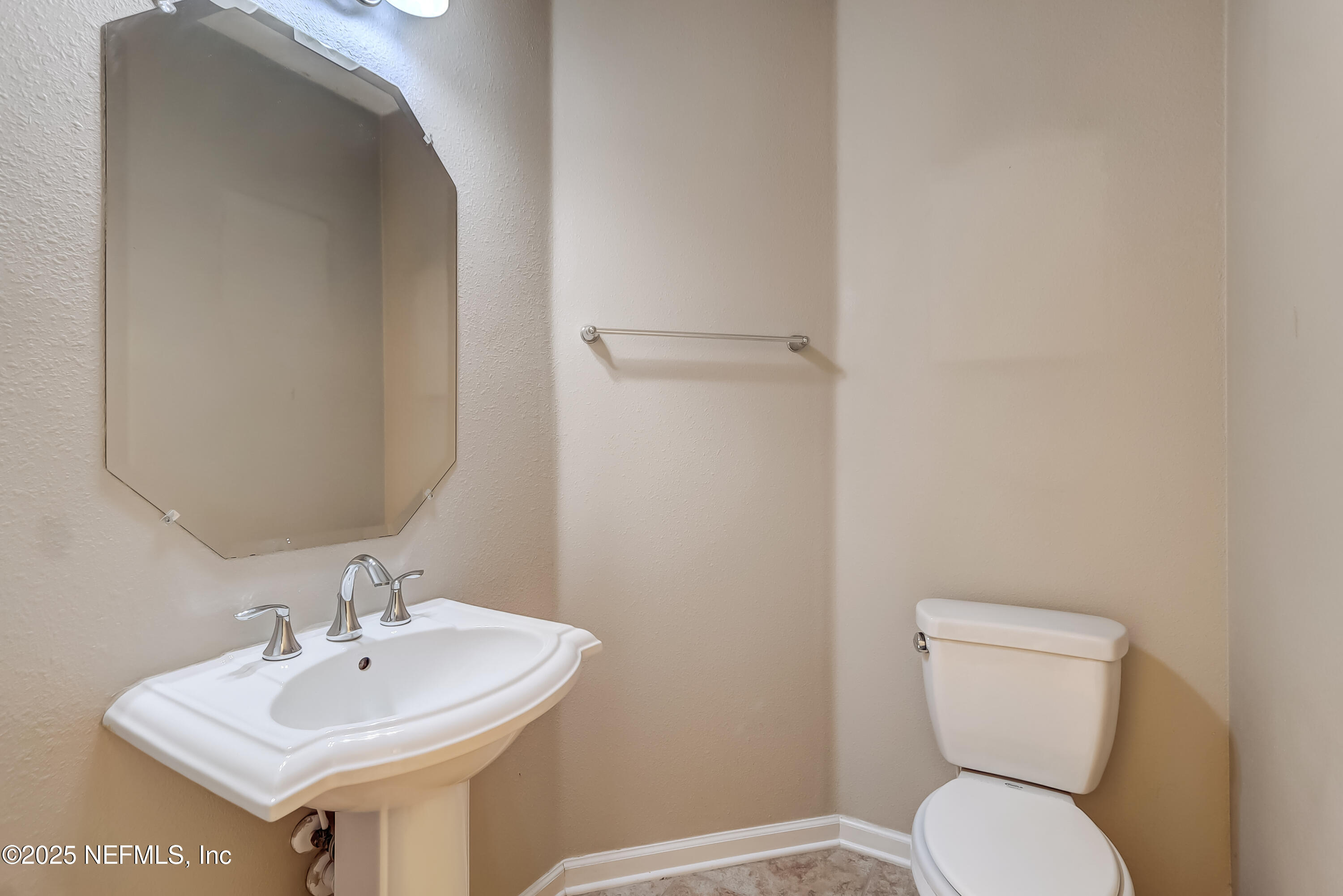 3838 Chasing Falls Road Orange Park, FL 32065 - Photo 18 of 36 a bathroom with a toilet sink and mirror