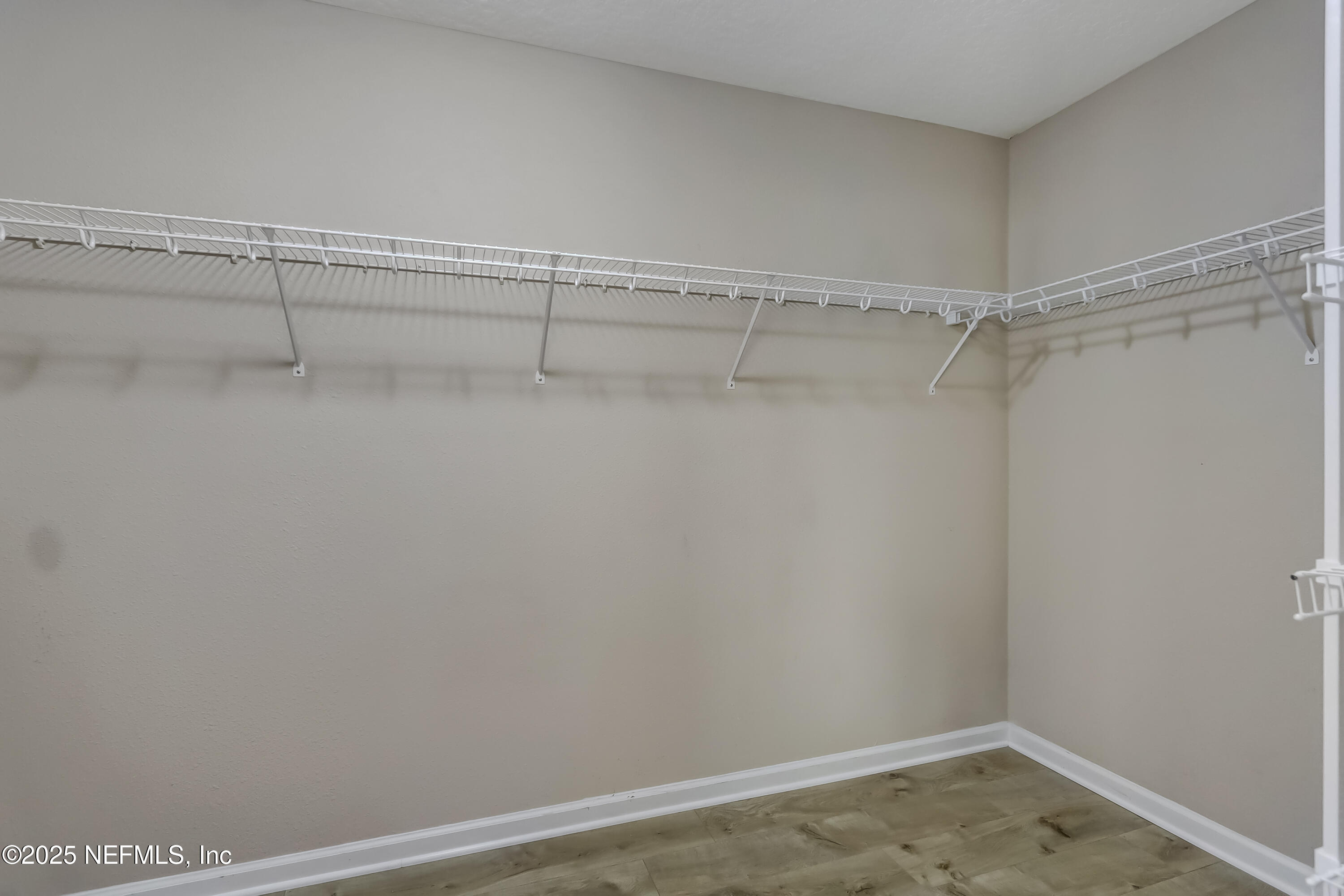 3838 Chasing Falls Road Orange Park, FL 32065 - Photo 24 of 36 a view of a room with racks on the wall