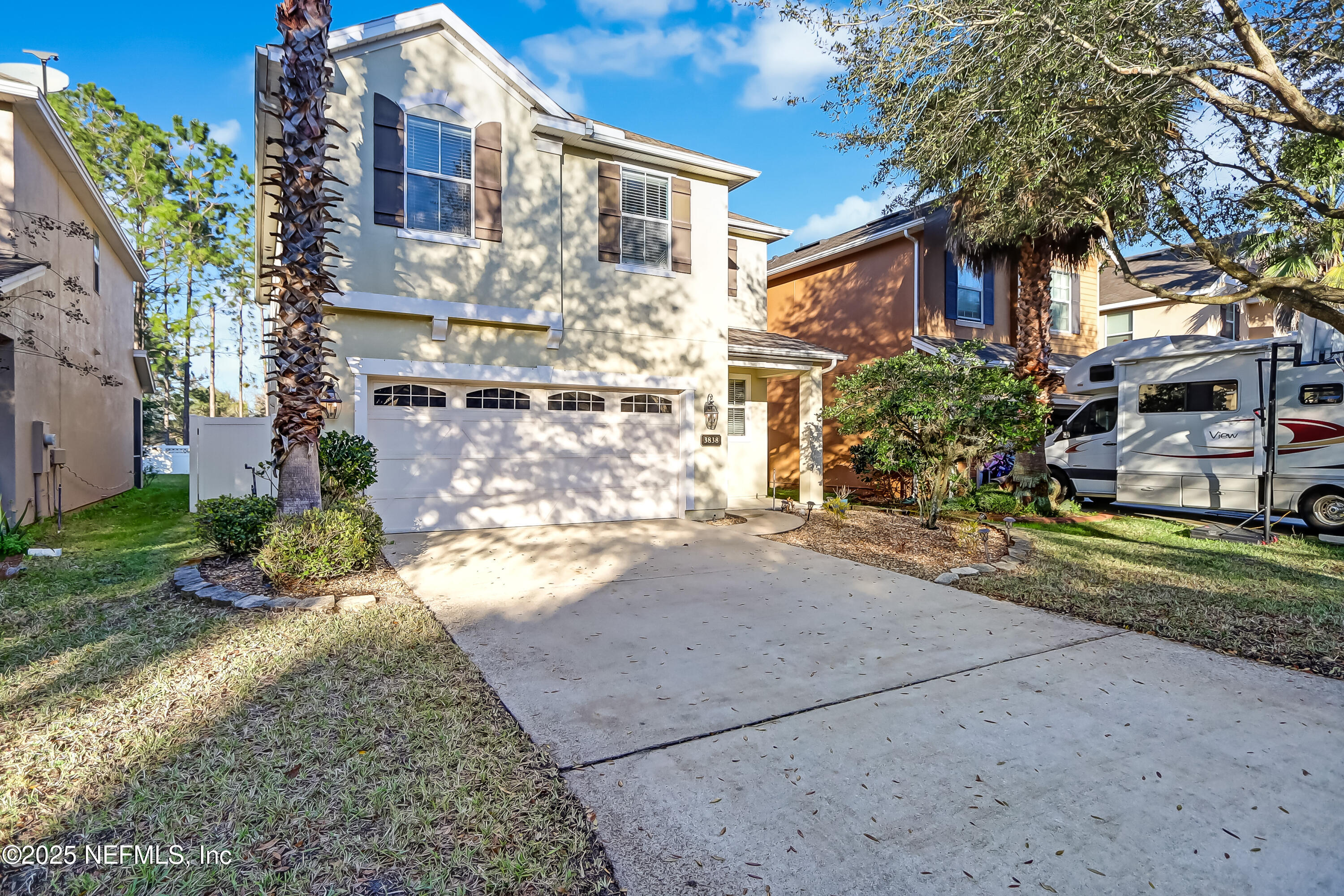 3838 Chasing Falls Road Orange Park, FL 32065 - Photo 3 of 36 a front view of a house with a yard and garage