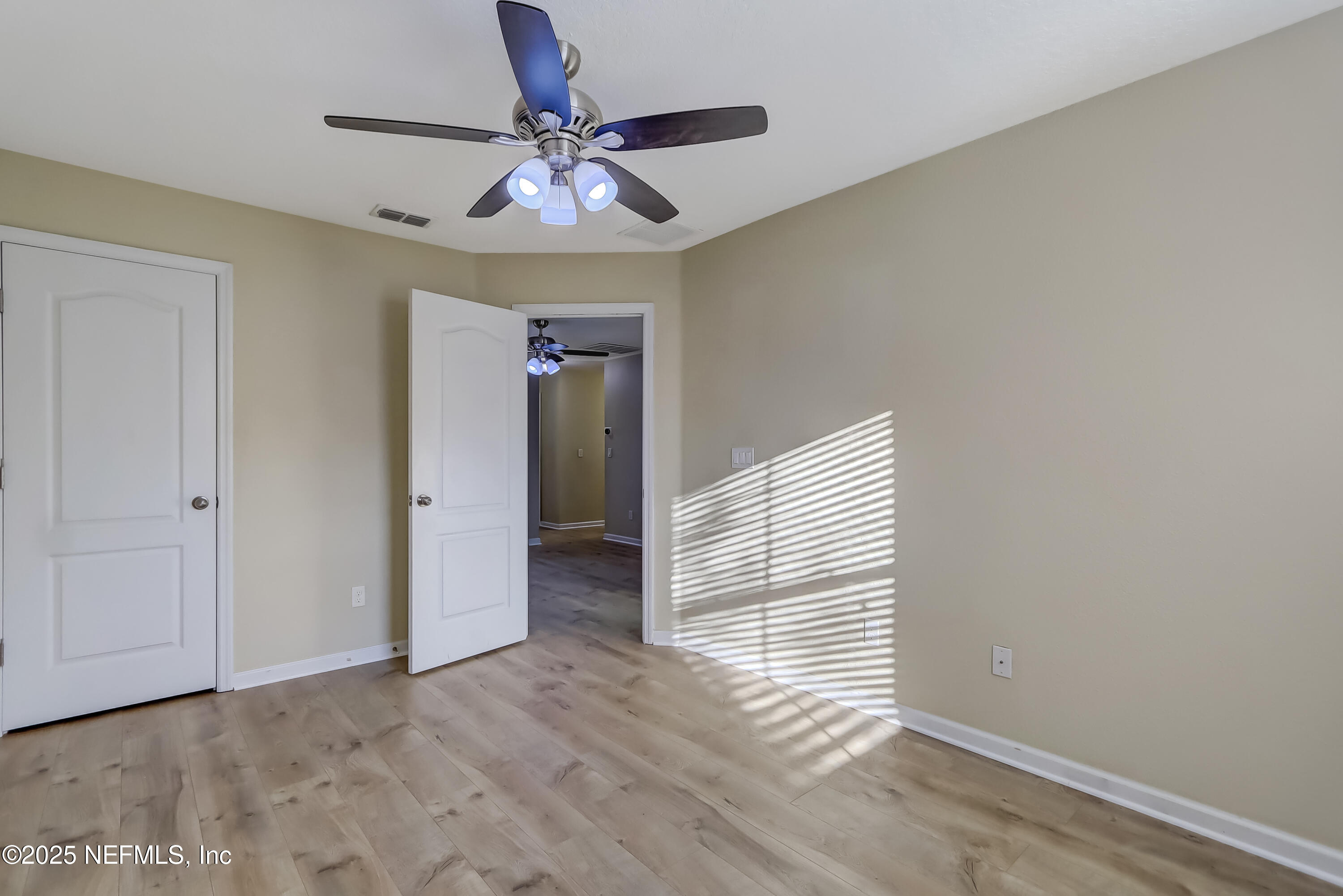 3838 Chasing Falls Road Orange Park, FL 32065 - Photo 31 of 36 a view of a livingroom with wooden floor and a ceiling fan