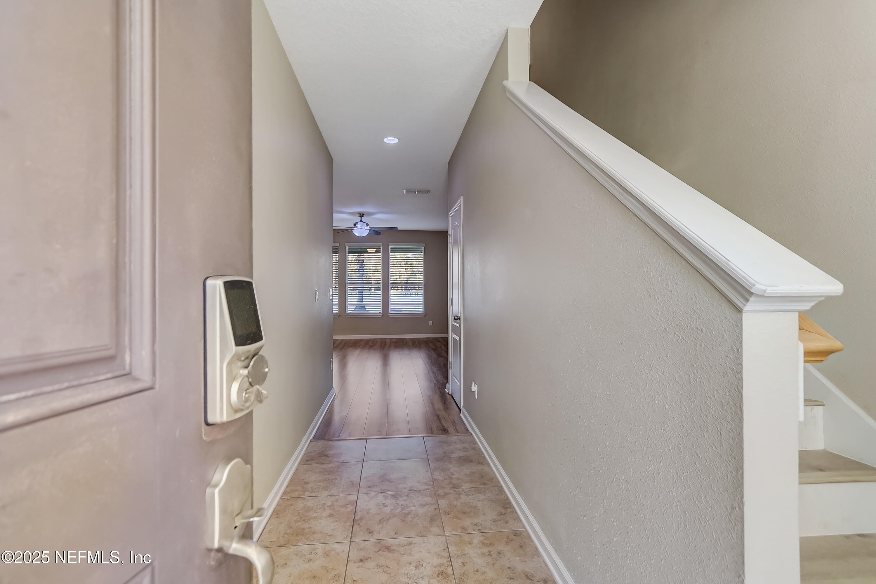 3838 Chasing Falls Road Orange Park, FL 32065 - Photo 5 of 36 a view of entryway and hall with wooden floor