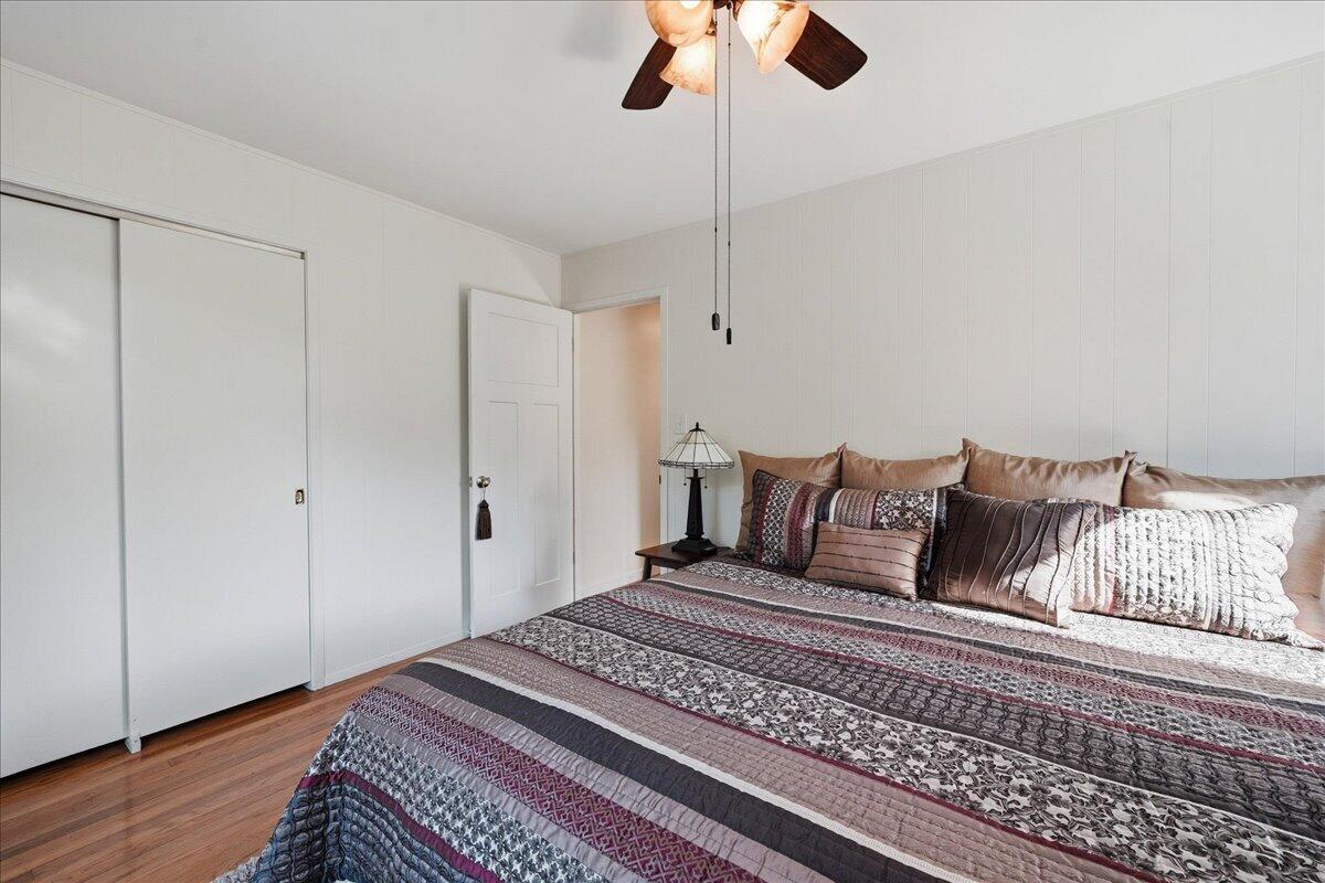 63 Ski Hill Road Portage, IN 46368 - Photo 12 of 28 a bed room with a bed and a ceiling fan