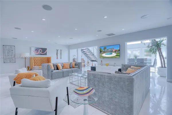 a kitchen with stainless steel appliances kitchen island granite countertop a stove and cabinets