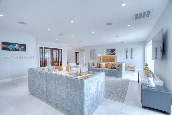 a view of a dining room and livingroom with furniture