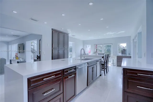 a living room with furniture large window and a table