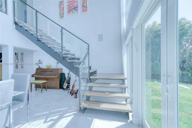 a bathroom with a granite countertop toilet a sink and a mirror