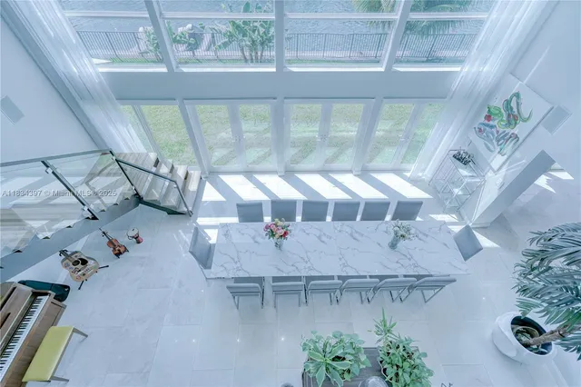 a bathroom with a granite countertop sink a toilet a shower and a mirror