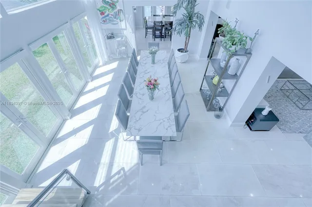 a bedroom with two beds and a chandelier