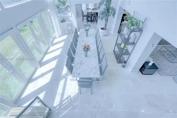 a bathroom with a granite countertop sink a toilet and a mirror