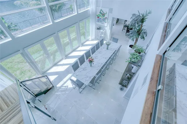 a bathroom with a granite countertop sink a toilet and a mirror