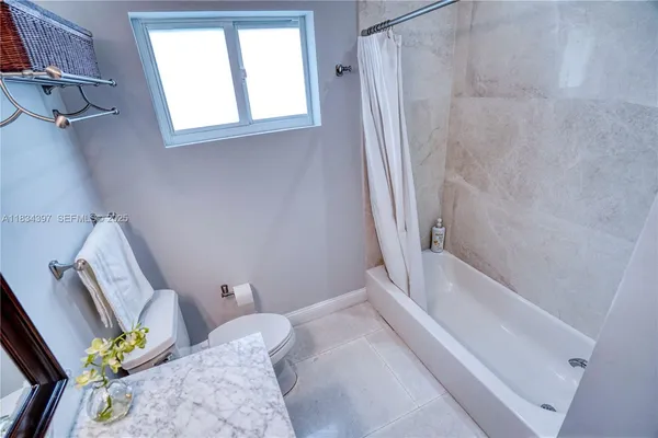 a bedroom with a workspace