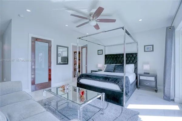 a view of walk in closet with clothes