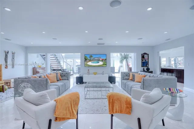 a kitchen with stainless steel appliances kitchen island granite countertop a stove and cabinets