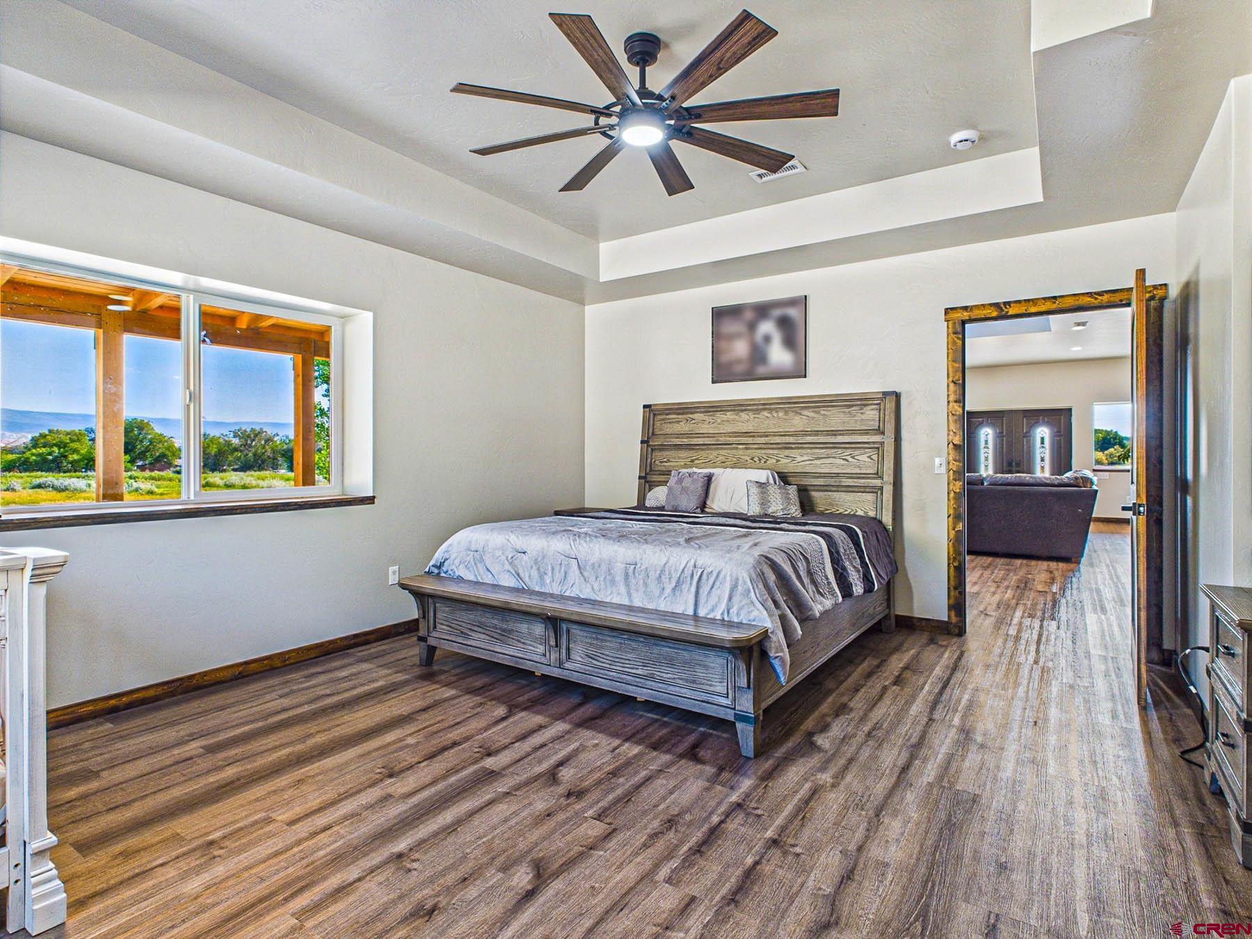 14885 G Road Delta, CO 81416 - Photo 17 of 45 a bedroom with a bed and wooden floor