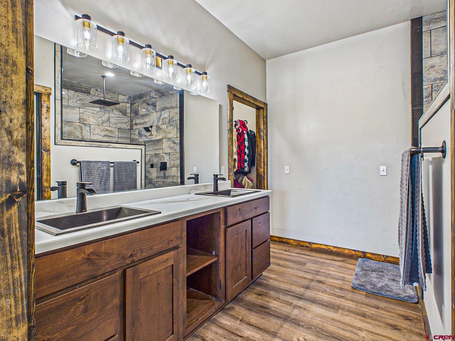 14885 G Road Delta, CO 81416 - Photo 18 of 45 a kitchen with stainless steel appliances granite countertop a sink and wooden cabinets