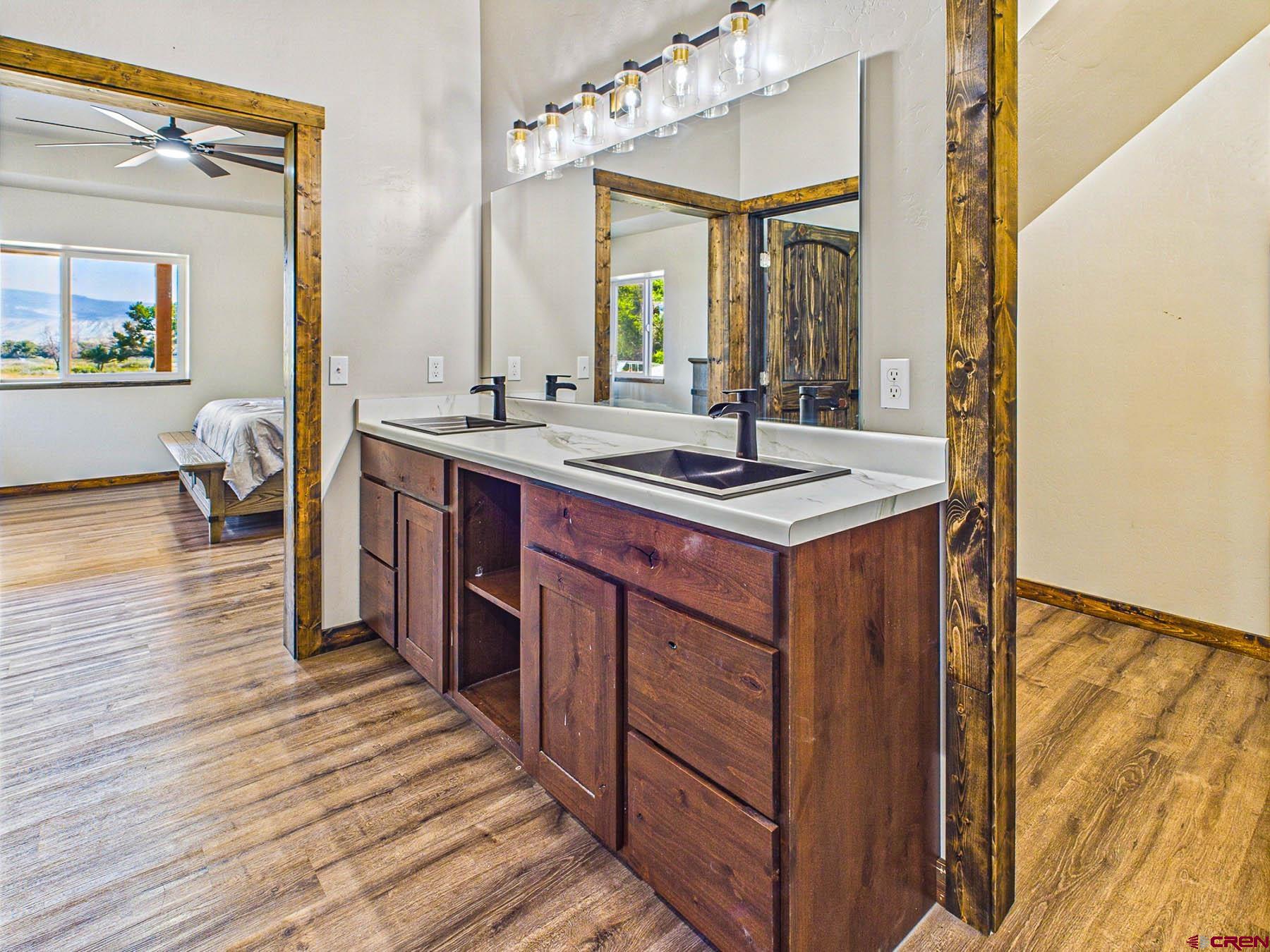 14885 G Road Delta, CO 81416 - Photo 19 of 45 a kitchen with stainless steel appliances granite countertop a sink and wooden cabinets