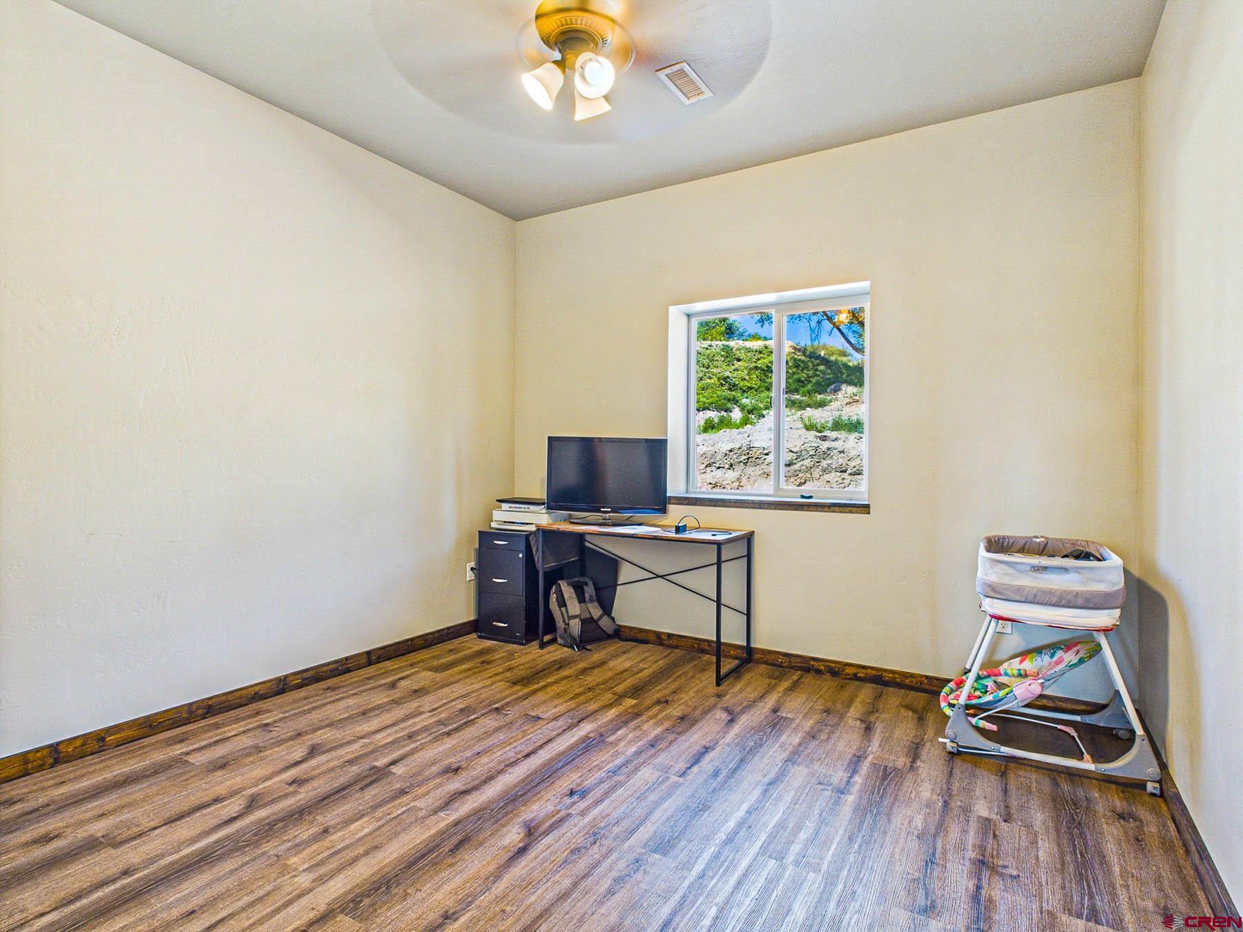 14885 G Road Delta, CO 81416 - Photo 21 of 45 a workspace with wooden floor