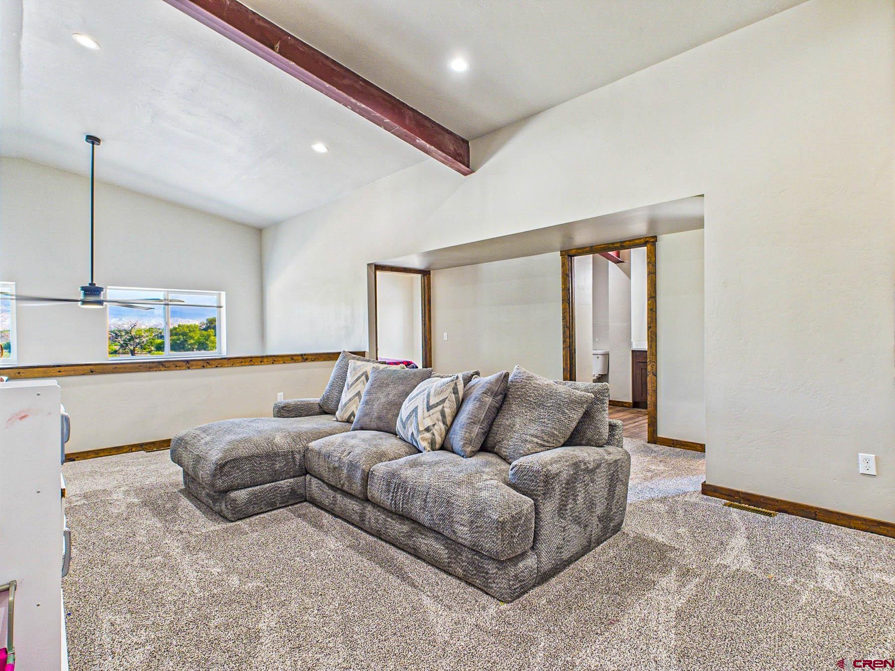 14885 G Road Delta, CO 81416 - Photo 25 of 45 a living room with furniture and a window