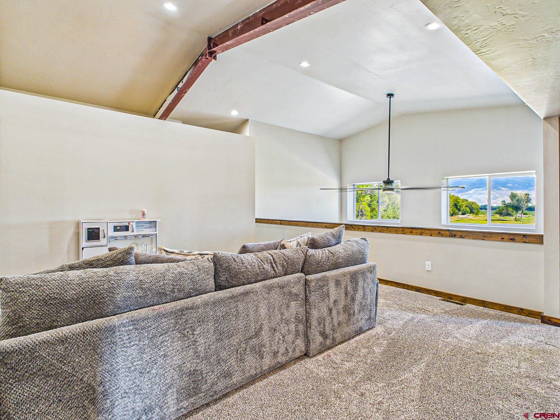 14885 G Road Delta, CO 81416 - Photo 26 of 45 a living room with furniture and wooden floor