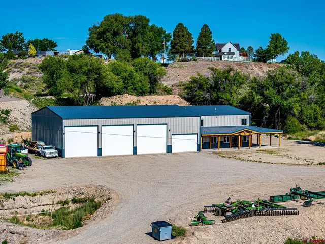a view of multiple houses with a yard