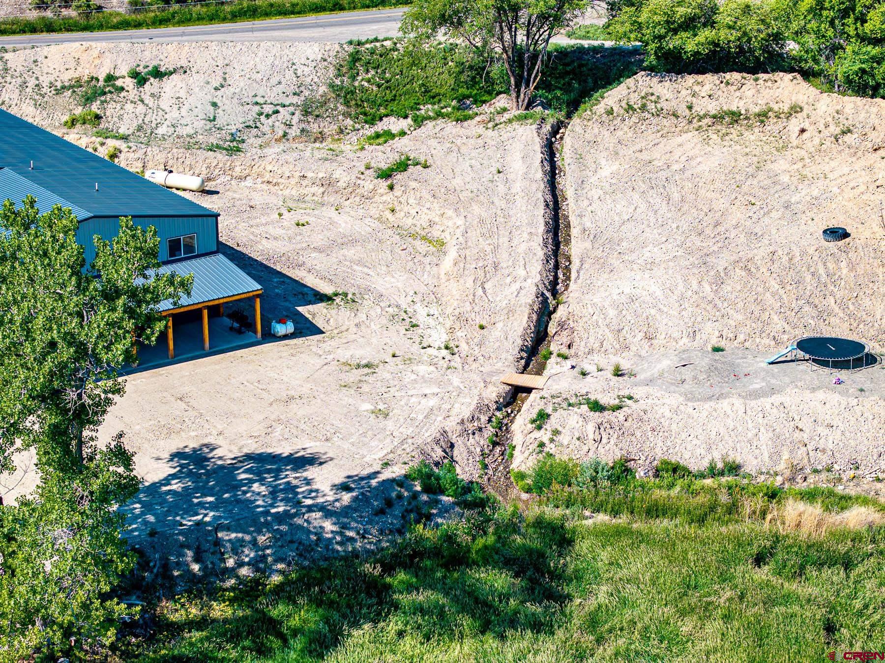 14885 G Road Delta, CO 81416 - Photo 41 of 45 a view of swimming pool with large tree