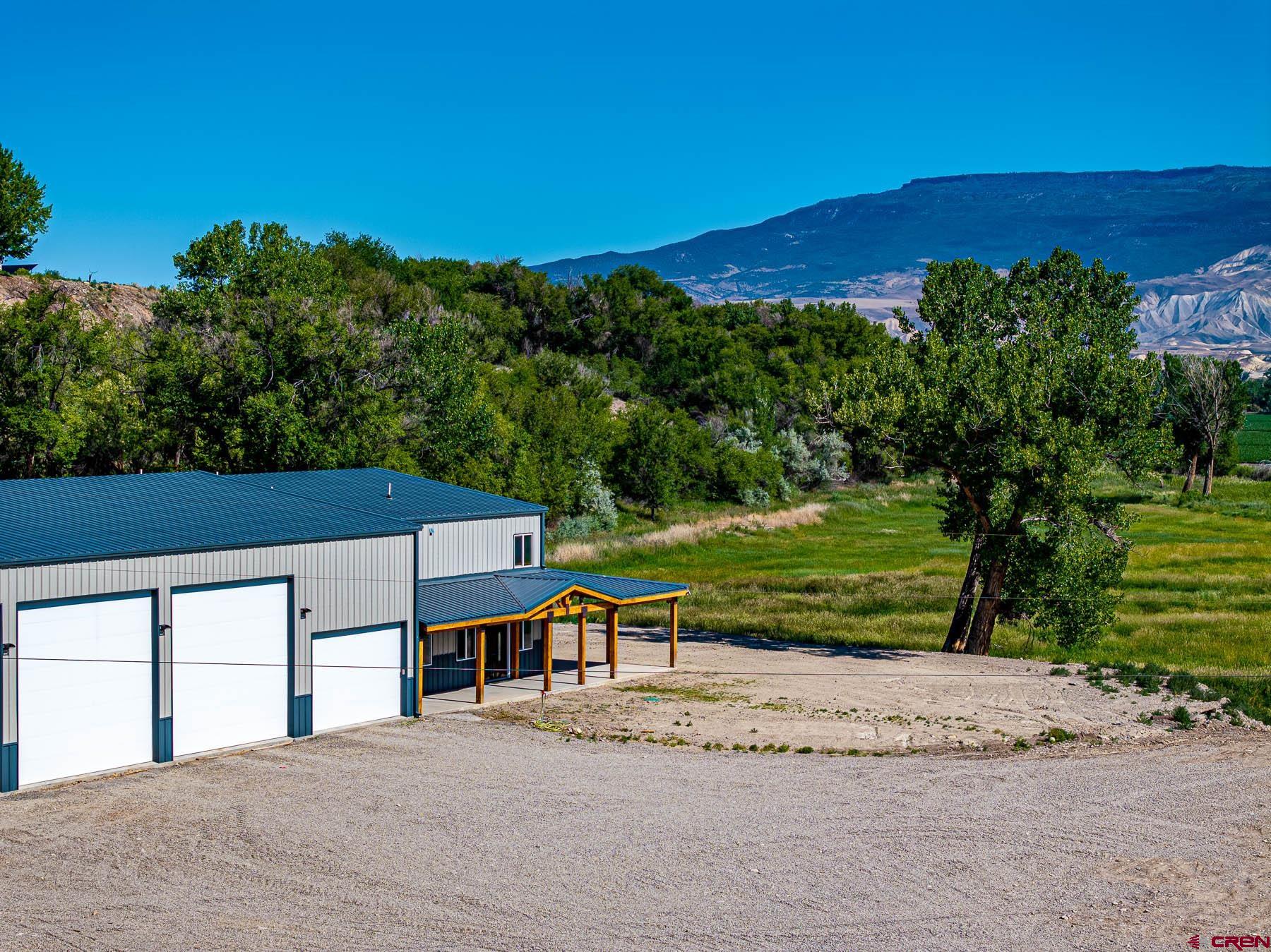 14885 G Road Delta, CO 81416 - Photo 9 of 45 a view of a house with a yard