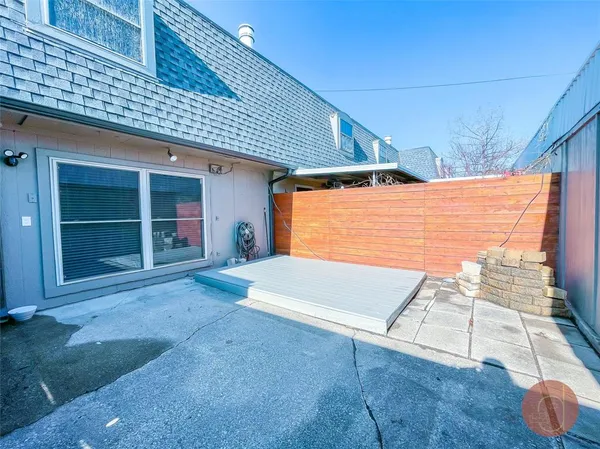 a kitchen with stainless steel appliances granite countertop a refrigerator a sink dishwasher a stove and white countertops with wooden floor