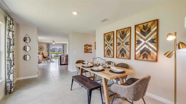 a dining room with furniture and wooden floor