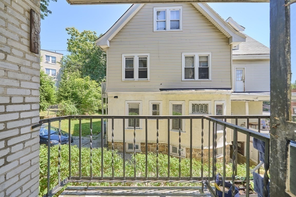 15 Colliston Road, Unit 6 Boston, MA 02135 - Photo 13 of 17 a view of a brick house with a large window
