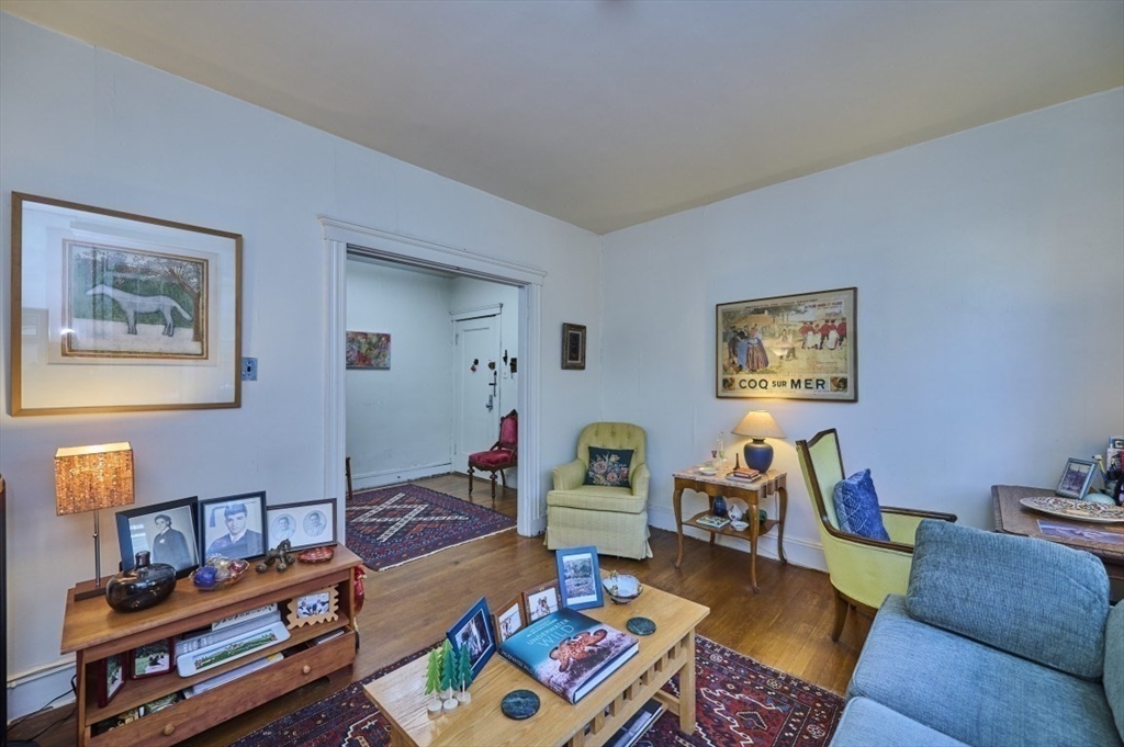 15 Colliston Road, Unit 6 Boston, MA 02135 - Photo 4 of 17 a living room with furniture and a wooden floor