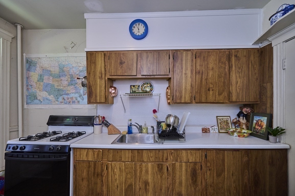 15 Colliston Road, Unit 6 Boston, MA 02135 - Photo 9 of 17 a kitchen with a stove and cabinets
