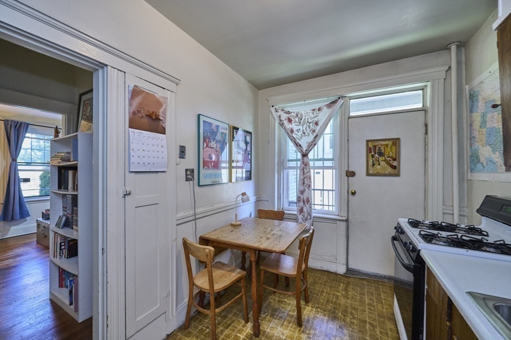 15 Colliston Road, Unit 6 Boston, MA 02135 - Photo 10 of 17 a living room with furniture and a table