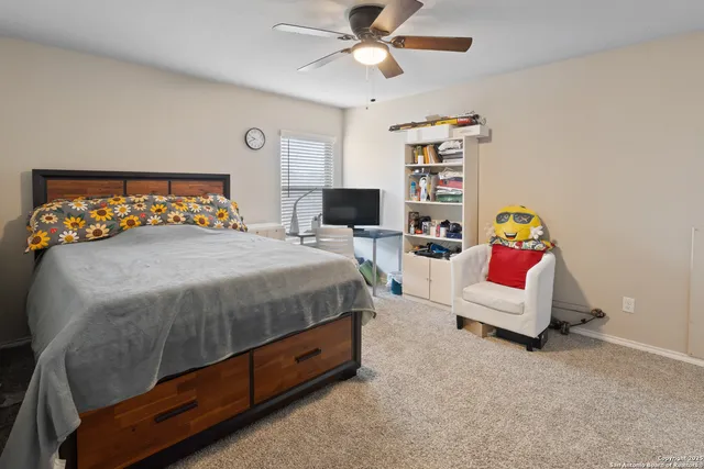 a bedroom with a bed furniture and window