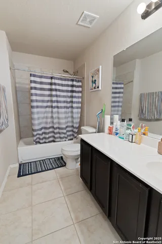 a bathroom with a bathtub a sink and a shower
