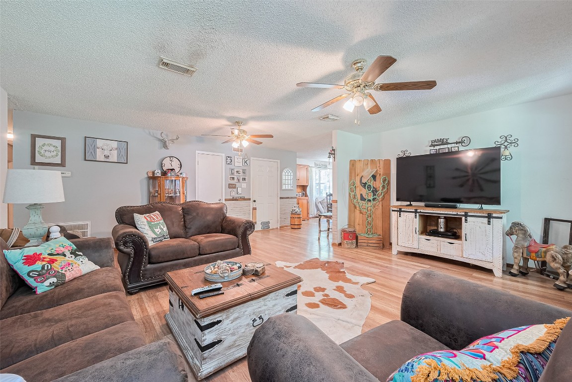 200 Little Pine Valley Road Cleveland, TX 77328 - Photo 13 of 43 a living room with furniture and a flat screen tv
