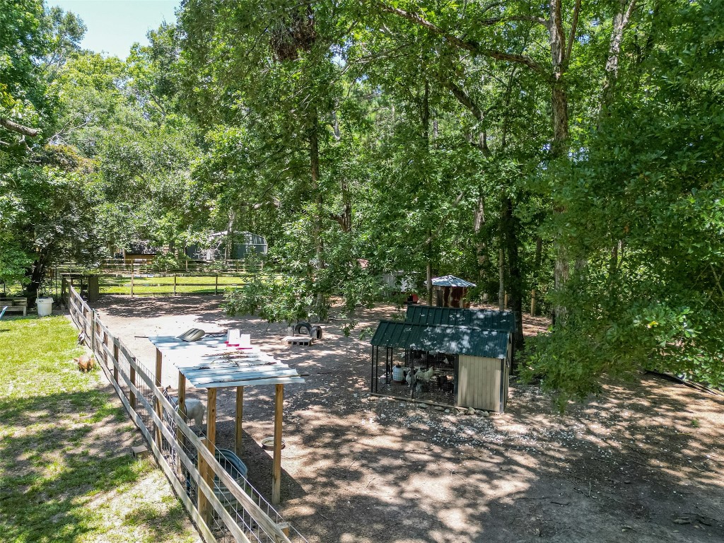 200 Little Pine Valley Road Cleveland, TX 77328 - Photo 15 of 43 a view of a chairs and table in the patio