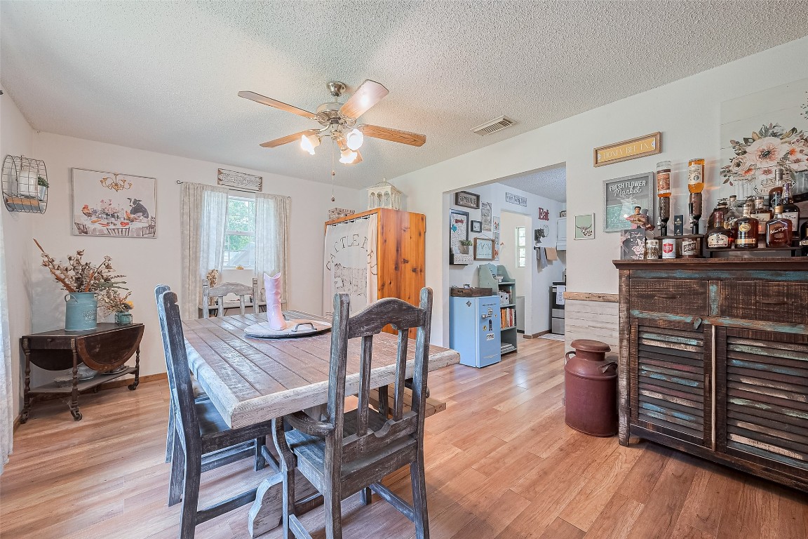 200 Little Pine Valley Road Cleveland, TX 77328 - Photo 17 of 43 a view of a dining room with furniture window and wooden floor