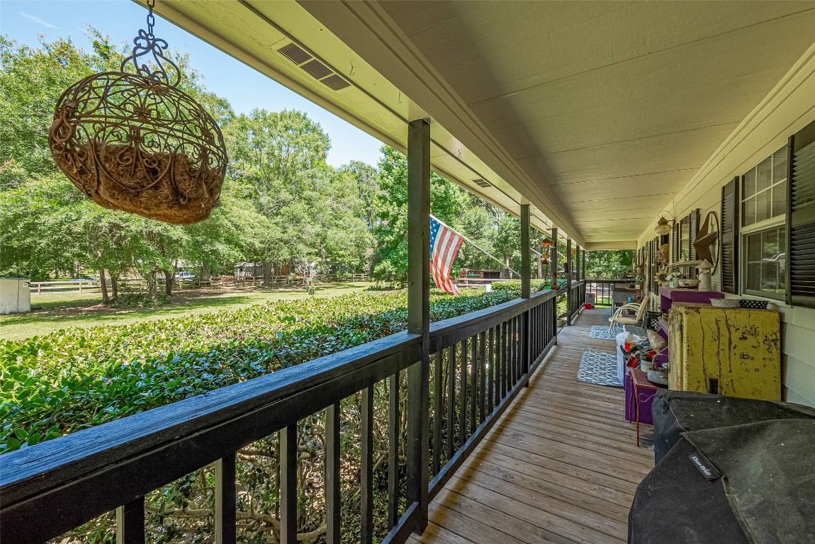200 Little Pine Valley Road Cleveland, TX 77328 - Photo 19 of 43 a view of a porch with wooden floor and deck