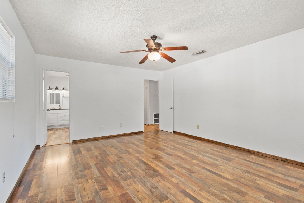200 Little Pine Valley Road Cleveland, TX 77328 - Photo 26 of 43 wooden floor in an empty room with a window