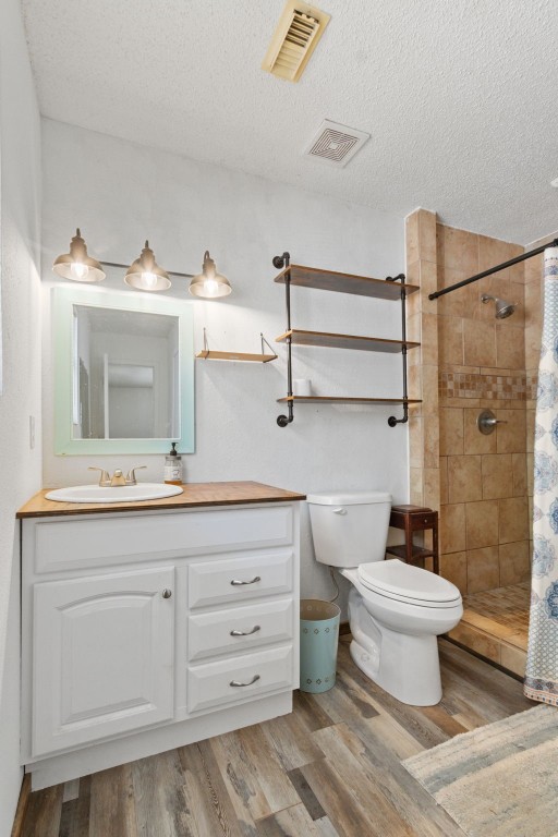 200 Little Pine Valley Road Cleveland, TX 77328 - Photo 27 of 43 a bathroom with a granite countertop sink a toilet and a mirror