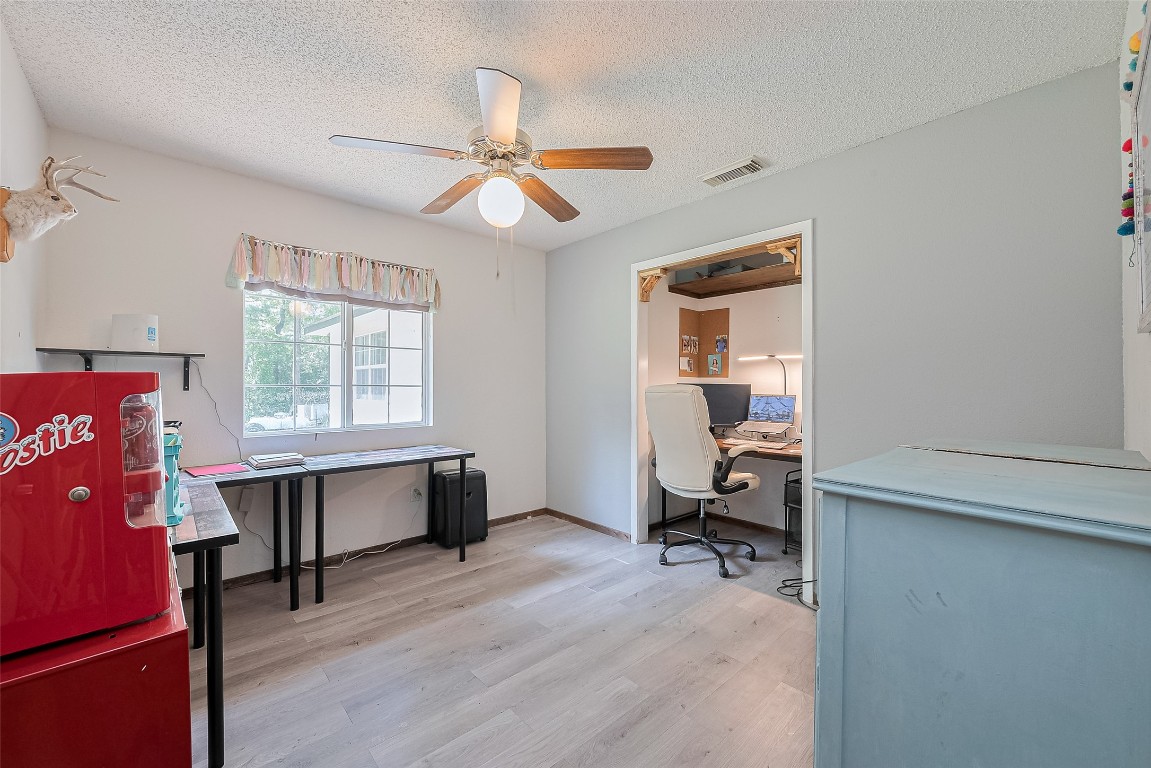 200 Little Pine Valley Road Cleveland, TX 77328 - Photo 29 of 43 a view of a workspace with furniture and a window