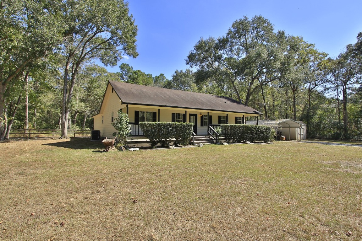 200 Little Pine Valley Road Cleveland, TX 77328 - Photo 3 of 43 a view of a house with backyard and sitting area