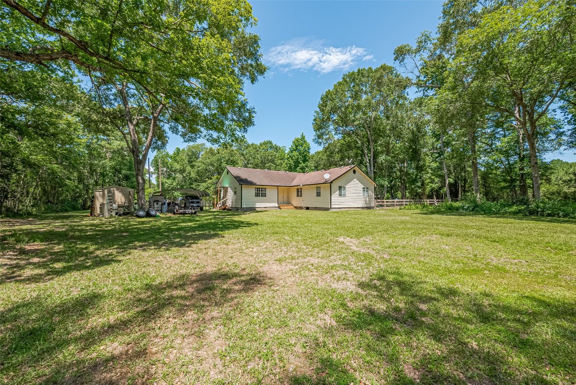 200 Little Pine Valley Road Cleveland, TX 77328 - Photo 36 of 43 a front view of a house with garden