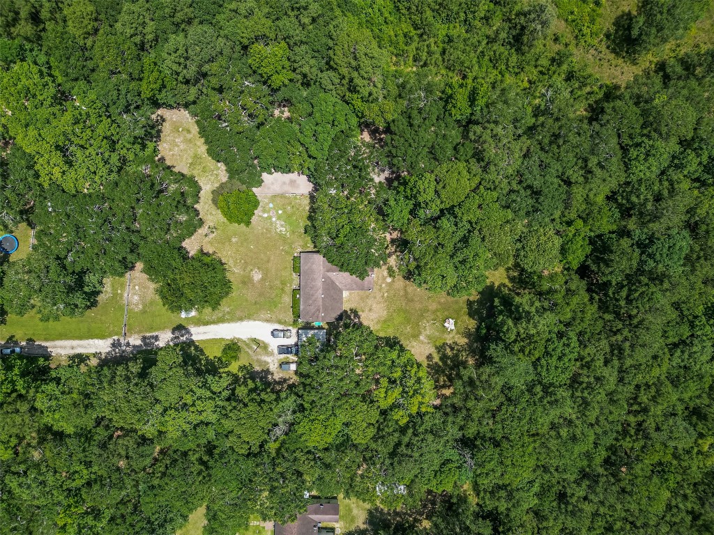 200 Little Pine Valley Road Cleveland, TX 77328 - Photo 8 of 43 an aerial view of residential house with outdoor space and trees all around